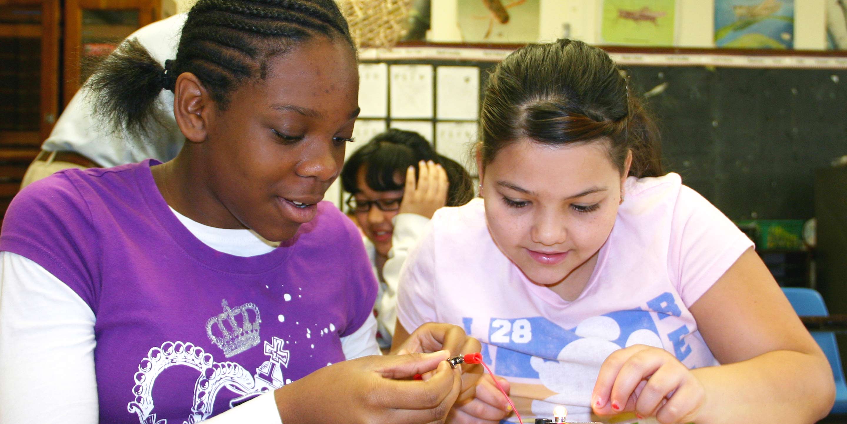 two girls in school doing STEM experiment