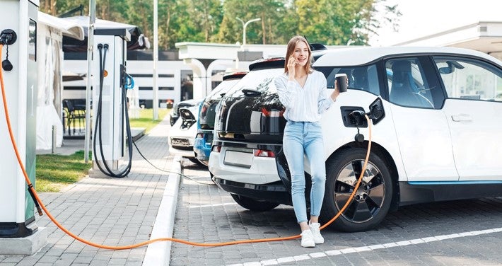 woman charging ev