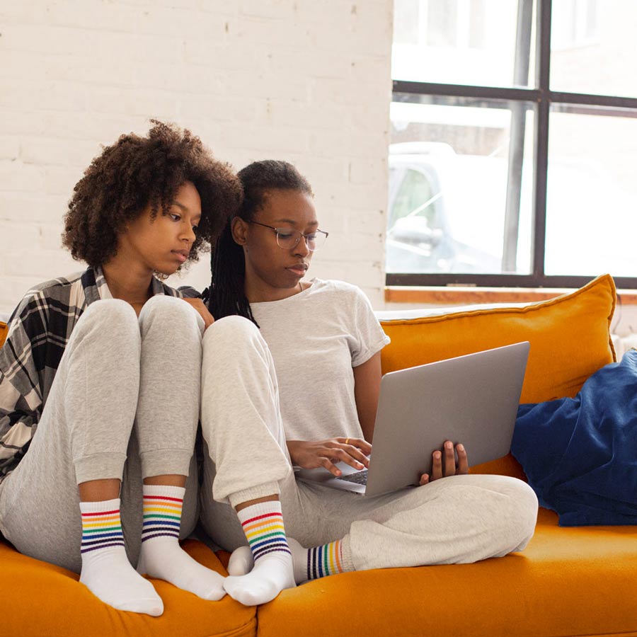 women reading a laptop