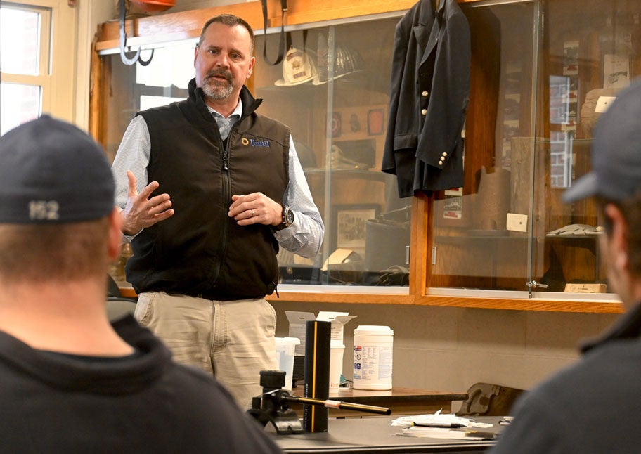 Members of the Auburn Fire Department listen to Mark Dupuis, Unitil’s director of Gas System and Transmission Operations