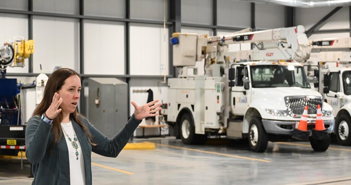 Sankowich speaks in front of Exeter facility trucks