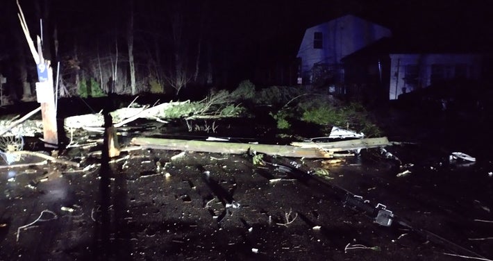 Tree and pole down at night