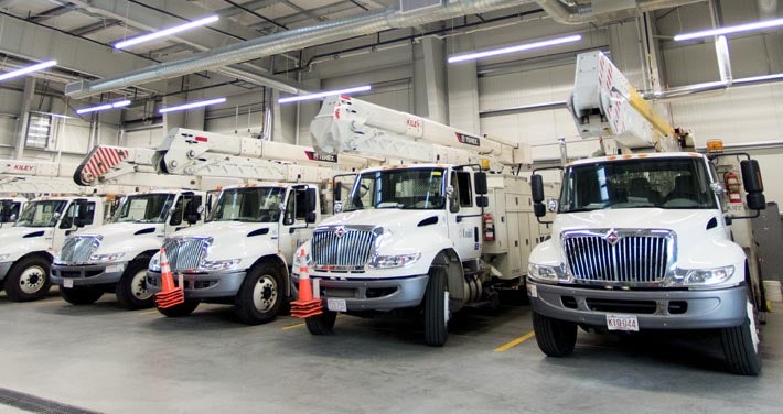 Unitil trucks lined up in garage