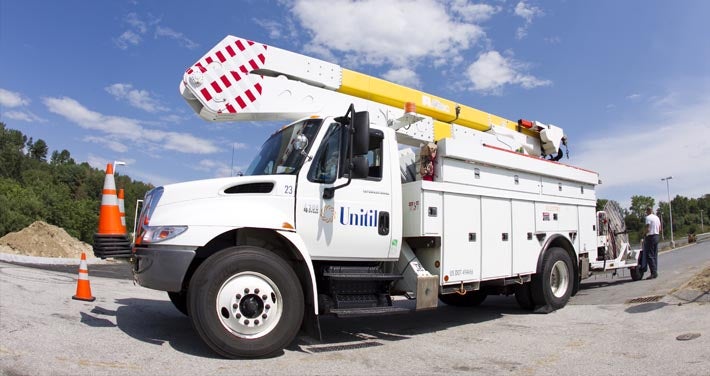 Unitil electric truck with safety cones on front