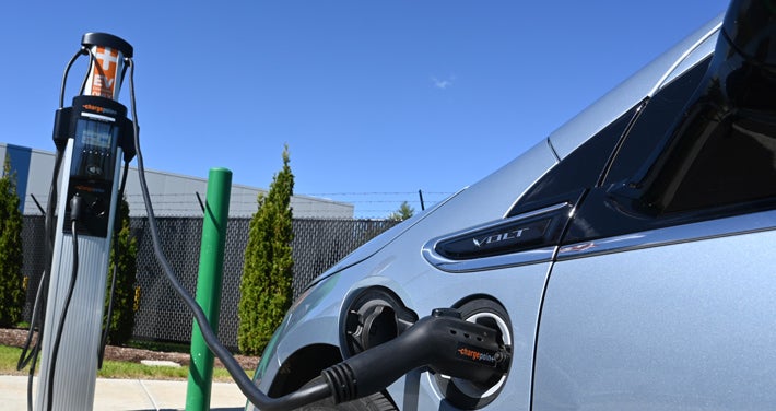 car attached to EV charging