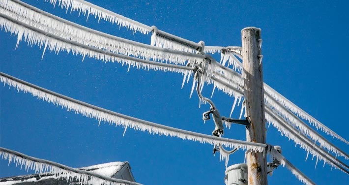 close up view of ice build up on power lines