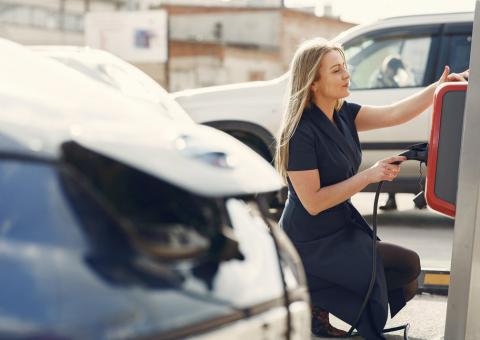 woman at ev charging station