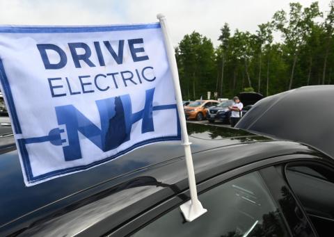 Drive Electric NH flag on EV car